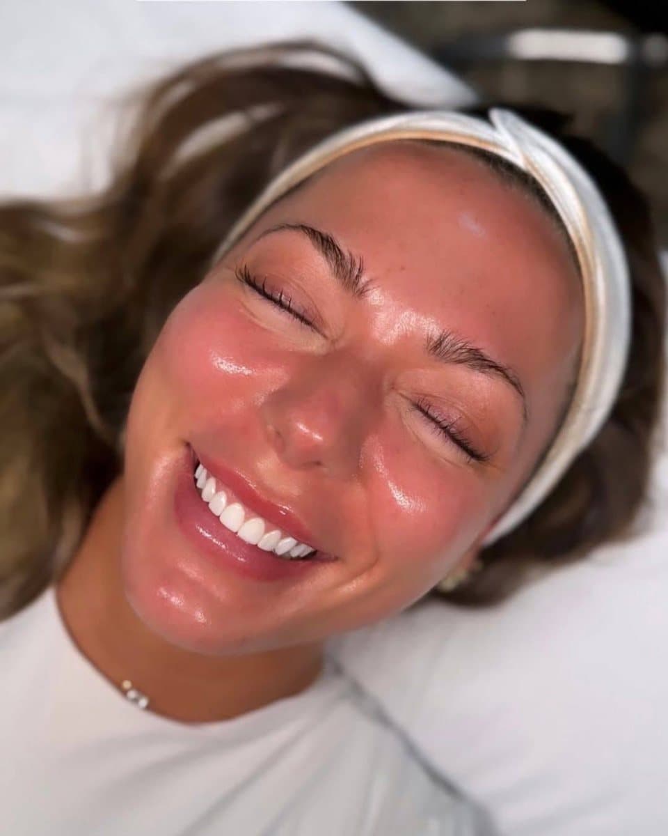 Client with radiant skin after a Hydrafacial treatment